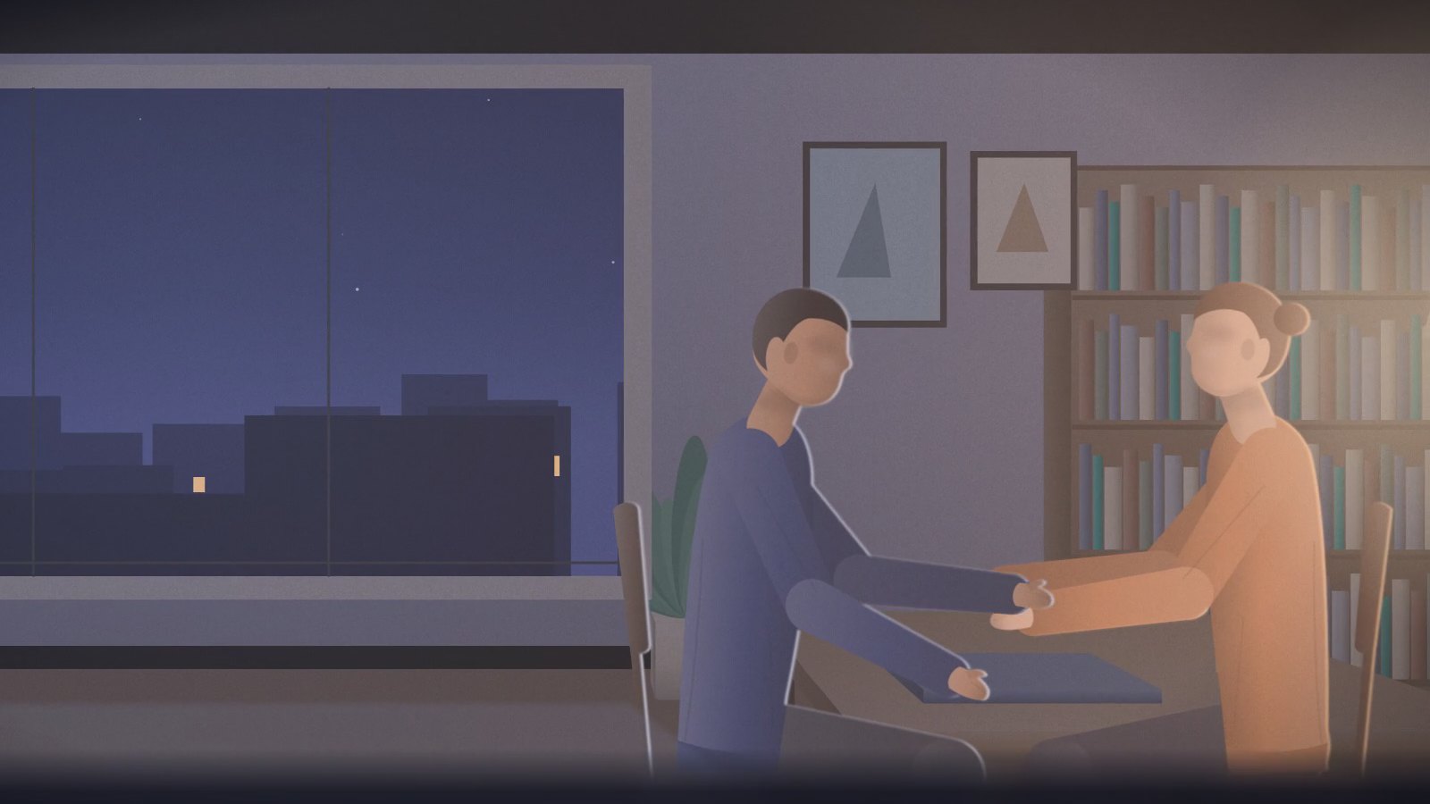 Still from our varicocele video: a couple holding hands at a table in the evening, the city at night through the window